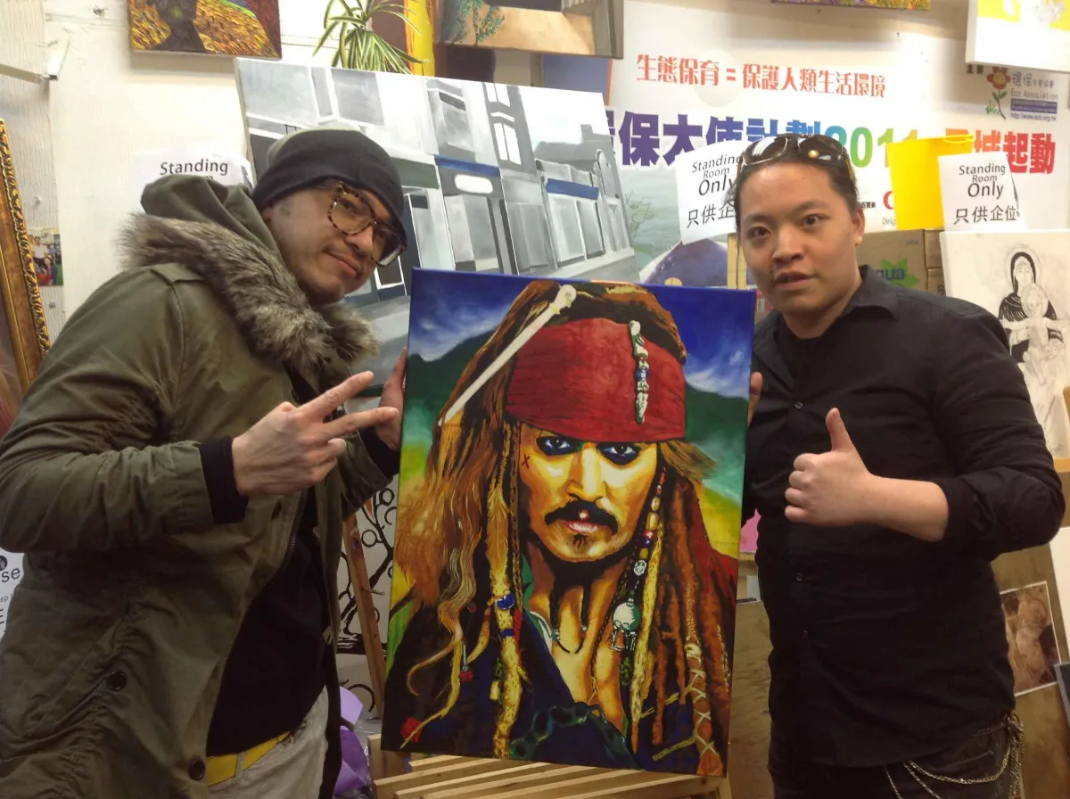Jackie and Michael Andrew Law and Johnny Depp Painting